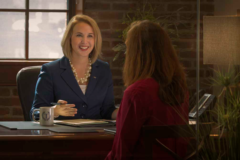 Private Bank, Chelsea Copan, with a member.