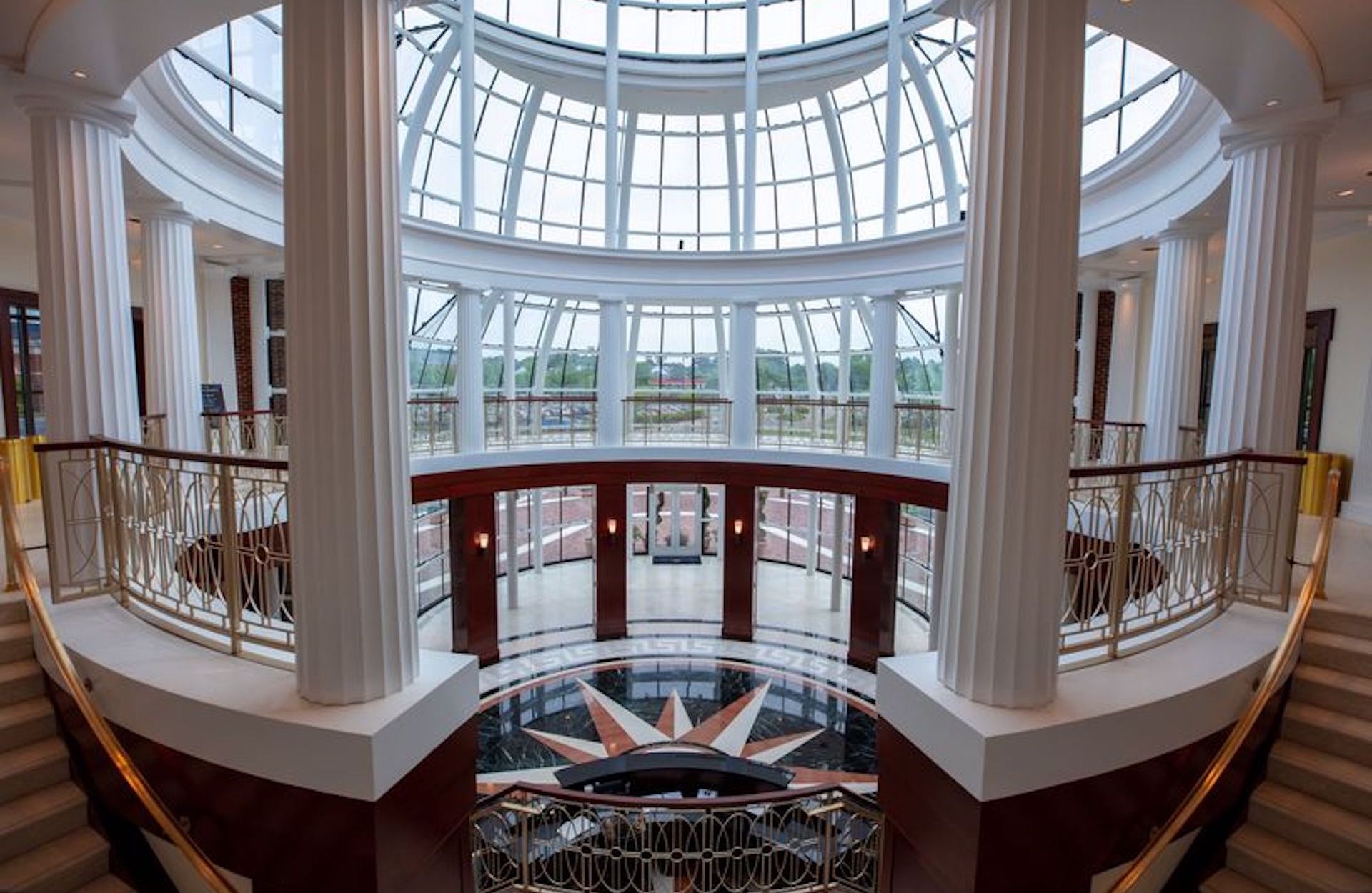 Interior photo of large glass domed building.